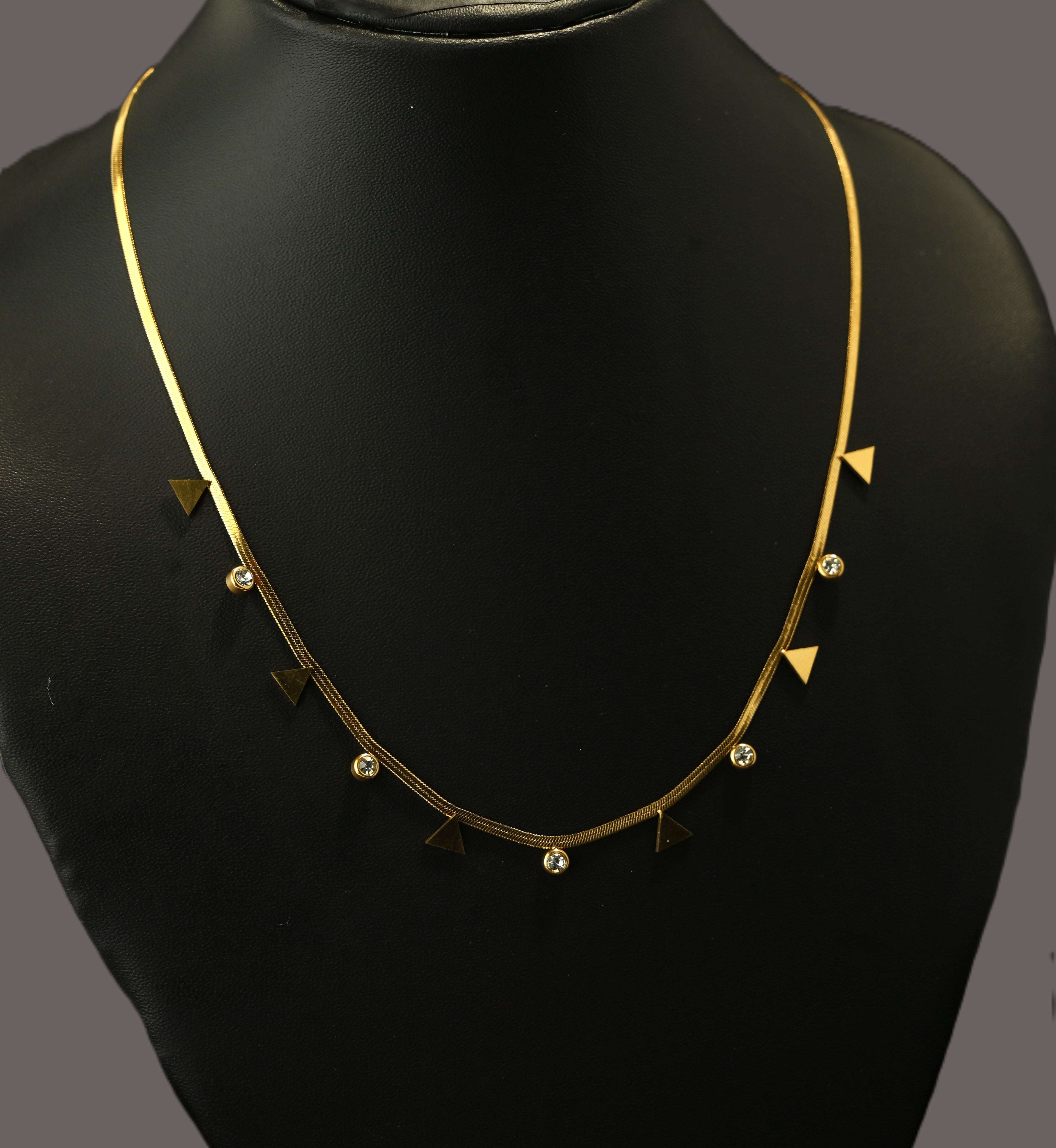 Gold Tone Premium Crystal Charms Snake Chain Necklace with Traingular Accents for Women - Glossy Finish
