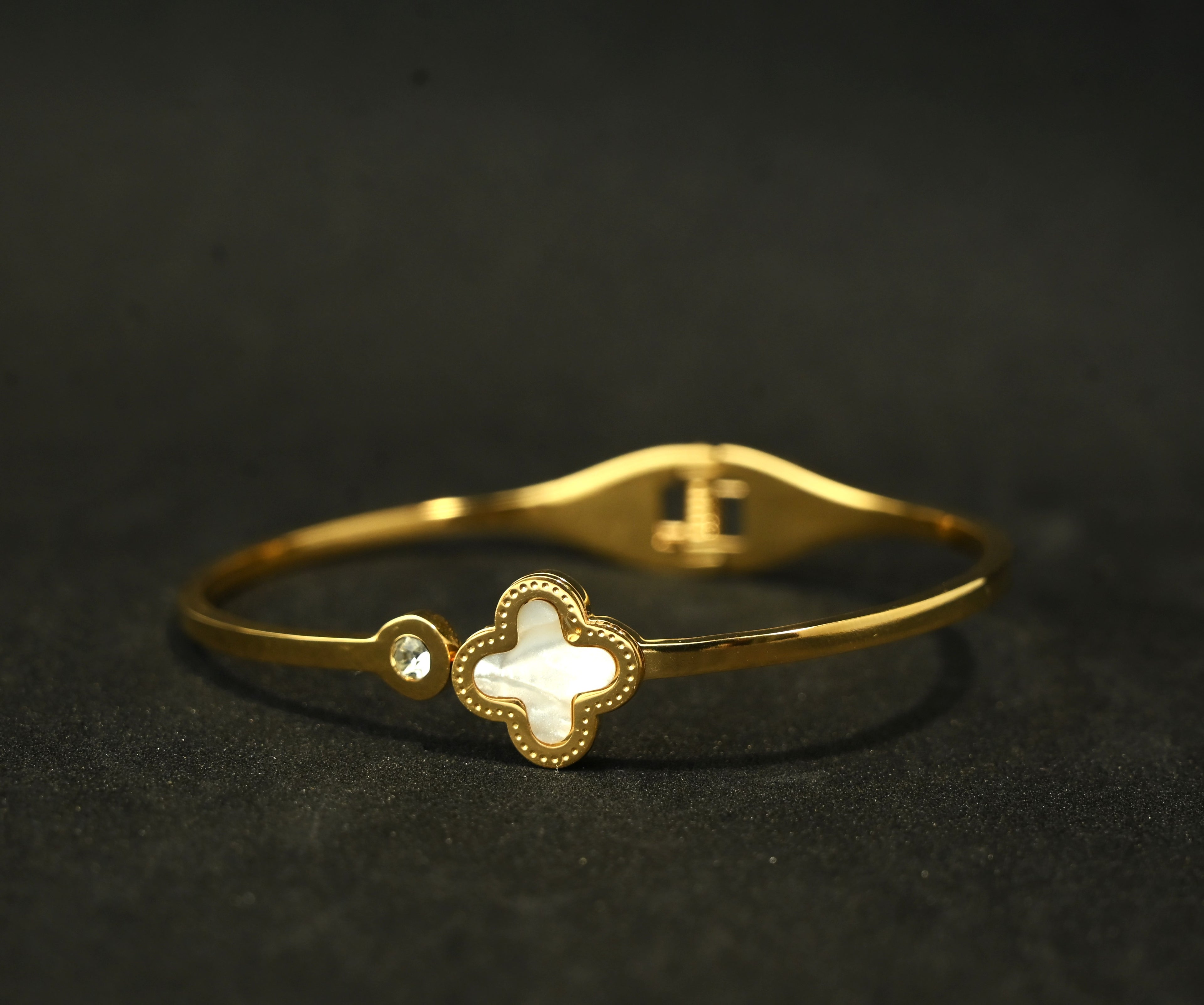 Gold Tone Mother of Pearl Clover Charm with Zirconia Accent Bangle Bracelet for Women - Sleek Finish