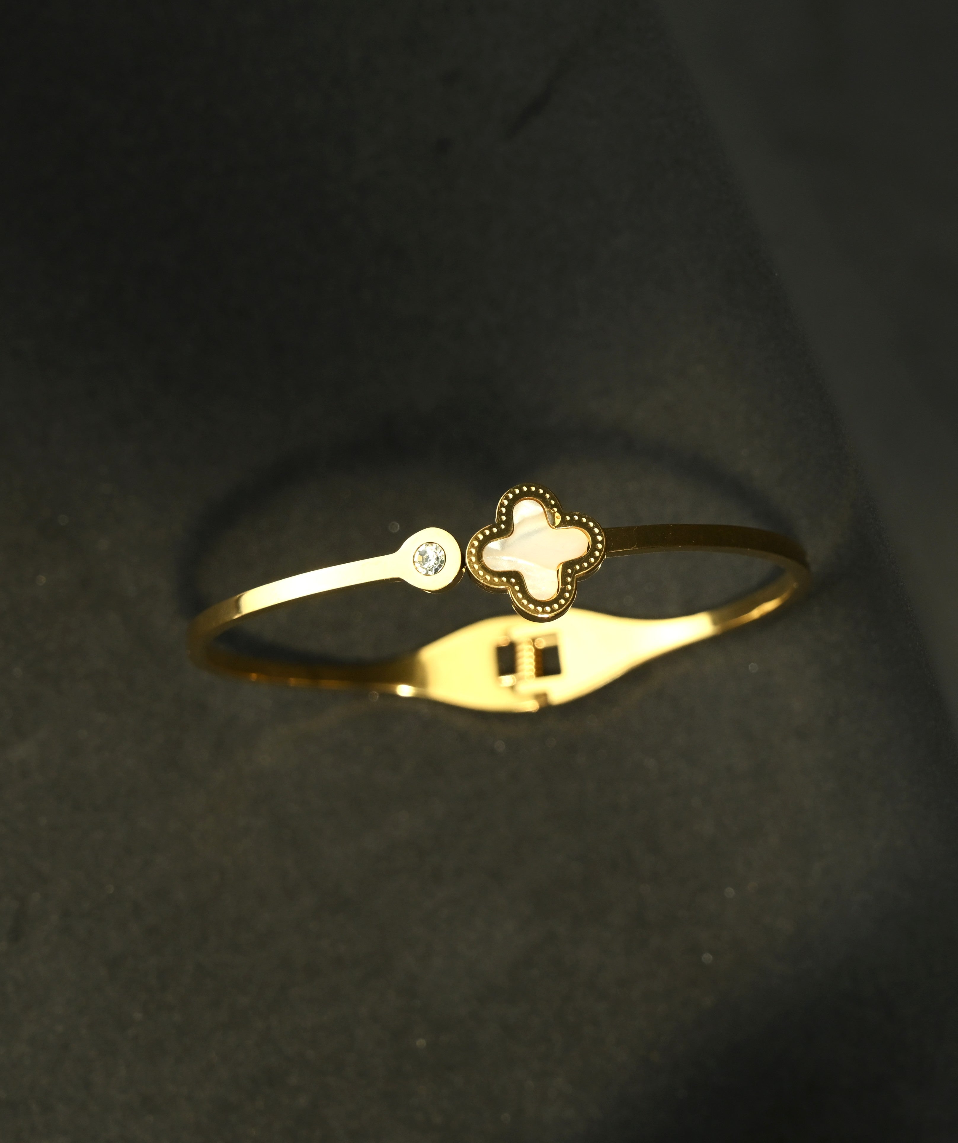 Gold Tone Mother of Pearl Clover Charm with Zirconia Accent Bangle Bracelet for Women - Sleek Finish