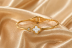 Gold Tone Mother of Pearl Clover Charm with Zirconia Accent Bangle Bracelet for Women - Sleek Finish