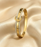 Gold Tone Stylish Buckle Detail Bangle Bracelet with Studded Zirconia for Women - Glossy Finish
