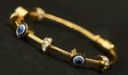 Gold Tone Elegant Lucky Eye Motifs Bangle Bracelet for Women- Glossy Finish (Baby Size)