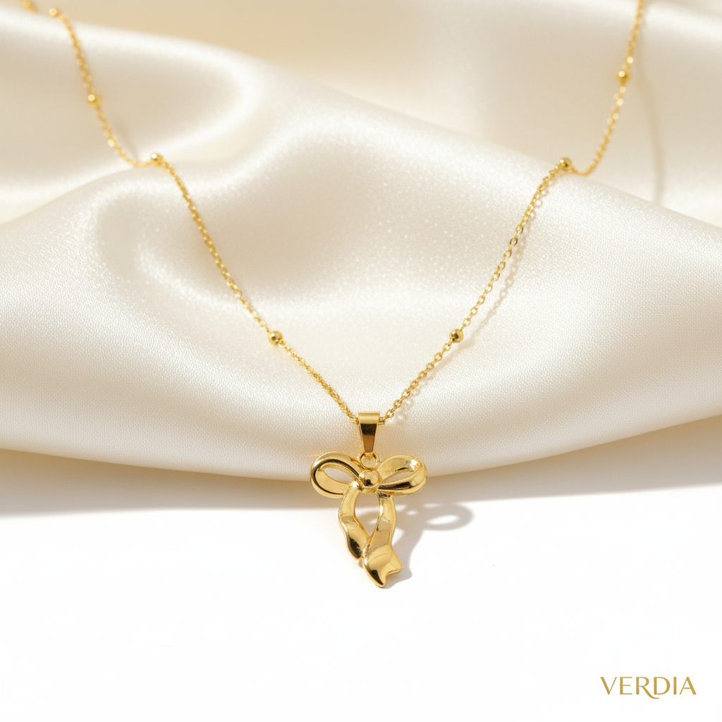 Gold-Tone Bow Pendant Stainless Steel Necklace for Women - Glossy Finish (21.5 Inches)