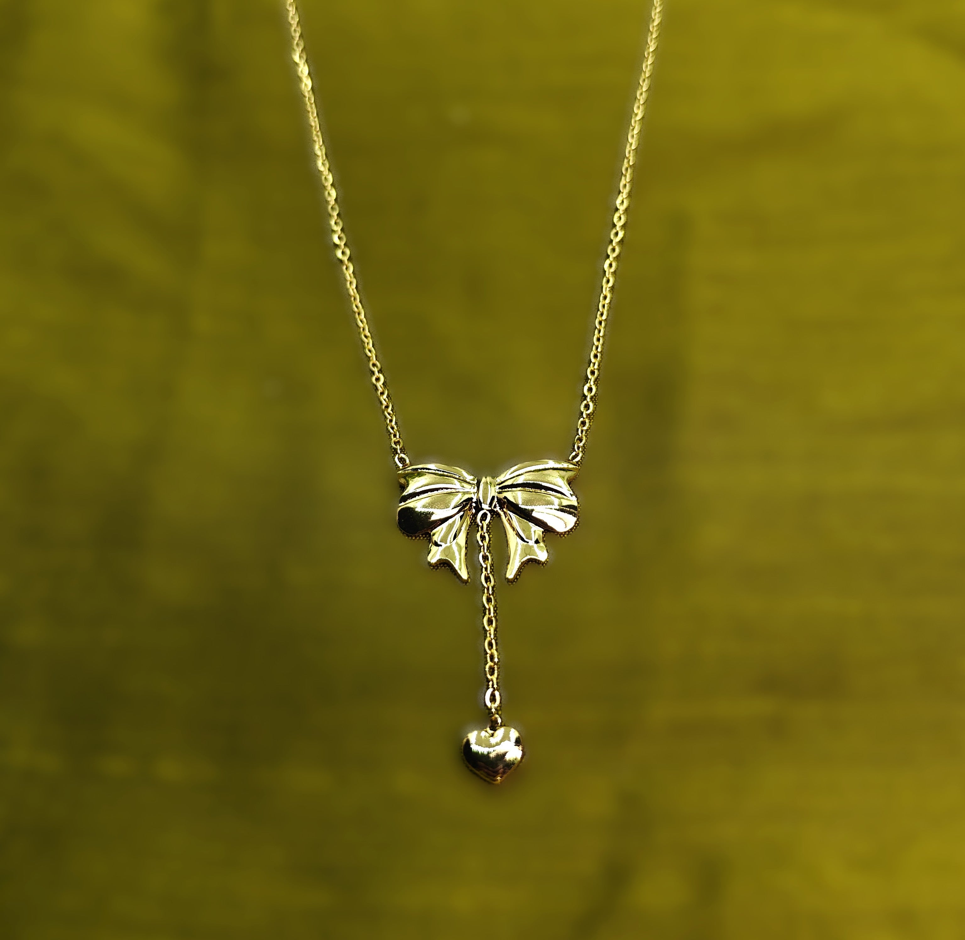 Gold-Tone Bow & Heart Drop Pendant Stainless Steel Necklace for Women - Glossy Finish (24 Inches)