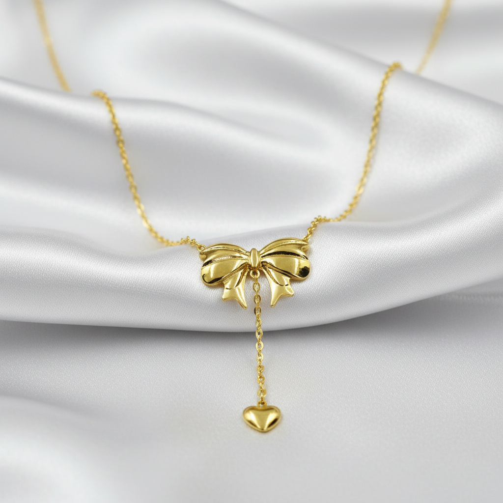 Gold-Tone Bow & Heart Drop Pendant Stainless Steel Necklace for Women - Glossy Finish (24 Inches)